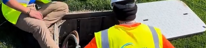 Workers wearing visibility vest.